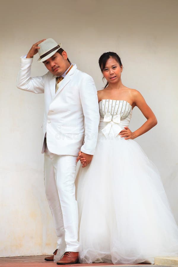 Couples of man and woman in wedding suit