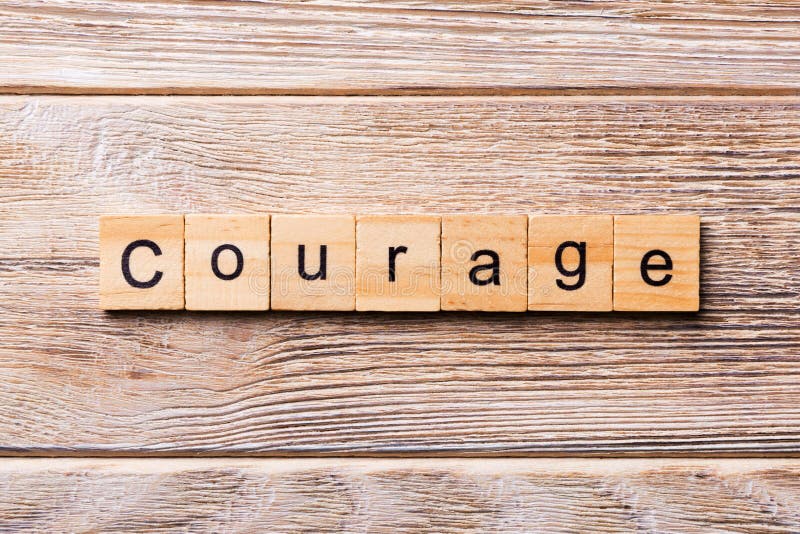 Courage Word Written on Wood Block. Courage Text on Wooden Table for ...