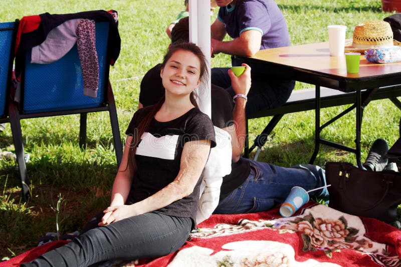 Courageous cheerful girl resting in the shade