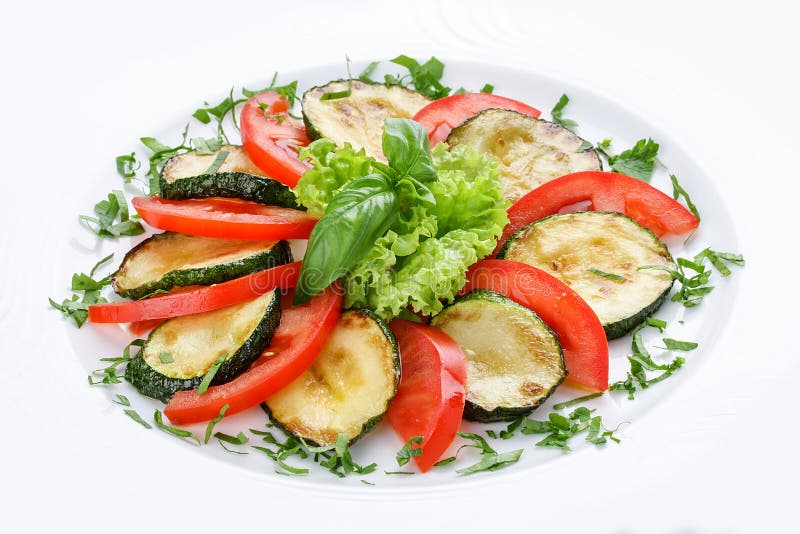 Courges à la moelle frites avec la verdure et les tomates image stock Courges à la moelle frites avec la verdure et les tomates image stock