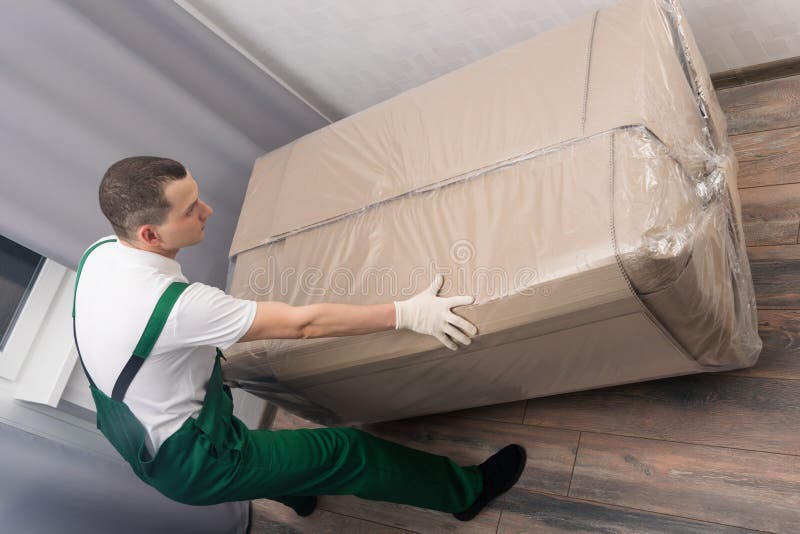 The Courier Brought the Packed Sofa into the Room Stock Image Image