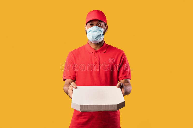 Download Courier Guy Holding Pizza Box Wearing Mask On Yellow Background Stock Image Image Of Cardboard Italian 182348991 PSD Mockup Templates