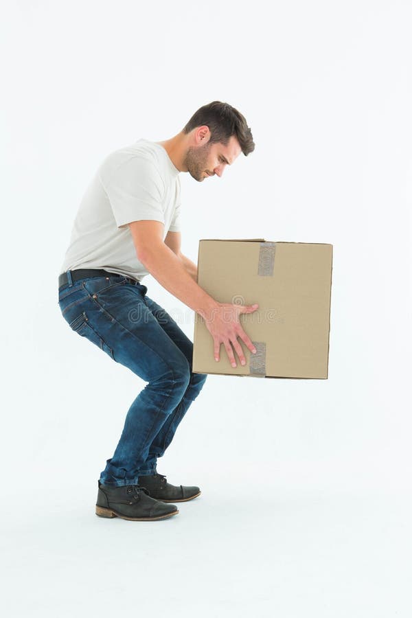 Courier Man Picking Up Cardboard Box Stock Image Image of effort