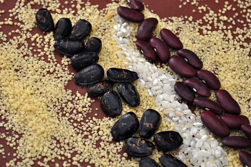 Couscous and colored seeds stock photo. Image of table 78640072