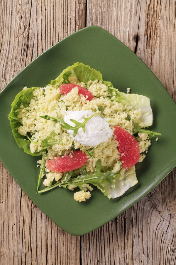 Couscous with Salad Greens and Tomatoes Stock Image Image of plate