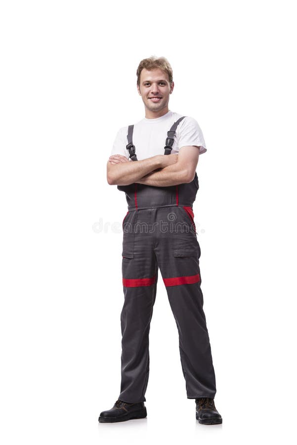 Coveralls молодого рабочий-строителя нося изолированные на белизне стоковые фотографии rf