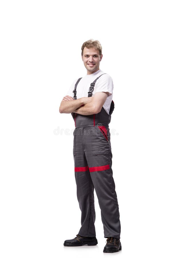Coveralls молодого рабочий-строителя нося изолированные на белизне стоковые фото