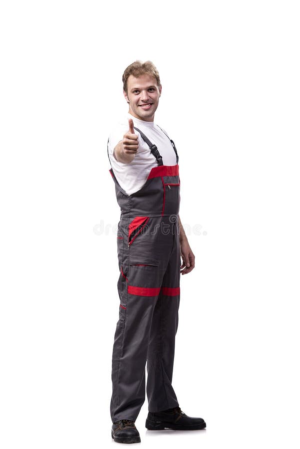 Coveralls молодого рабочий-строителя нося изолированные на белизне стоковые изображения