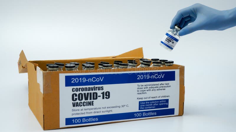 Covid-19 Corona Virus 2019-ncov vaccine vials medicine drug bottles injection blue nitrile surgical gloves box. Vaccination