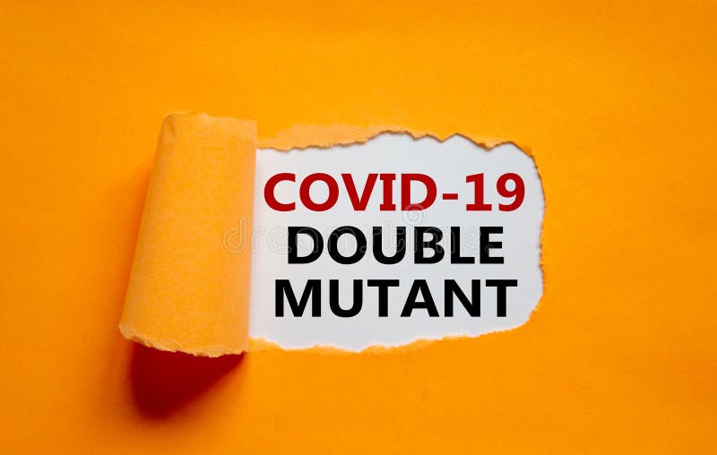 Covid-19 double mutant symbol. Words `Covid-19 double mutant` appearing behind torn orange paper. Medical and COVID-19 pandemic