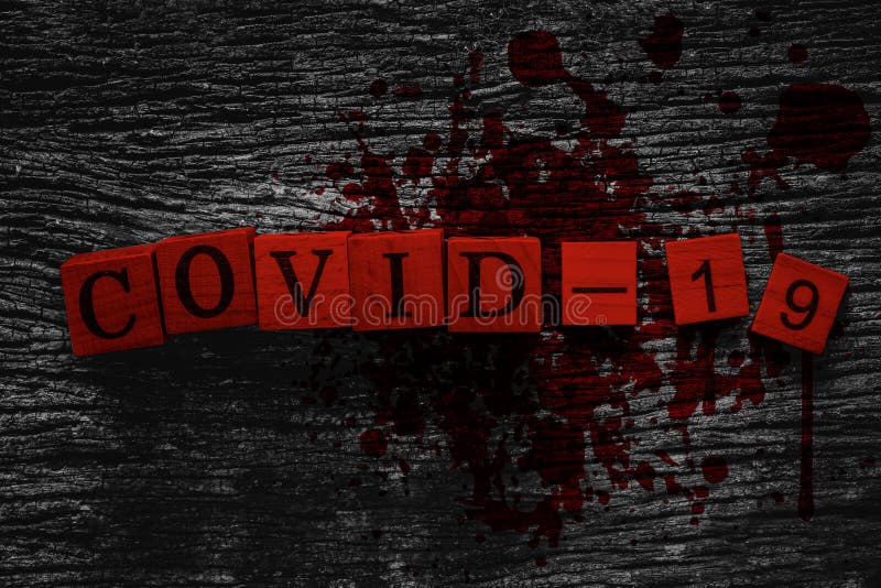 COVID-19 name of Corona virus text on old wood block with blood and gore effect for scary look for web title banner background design.