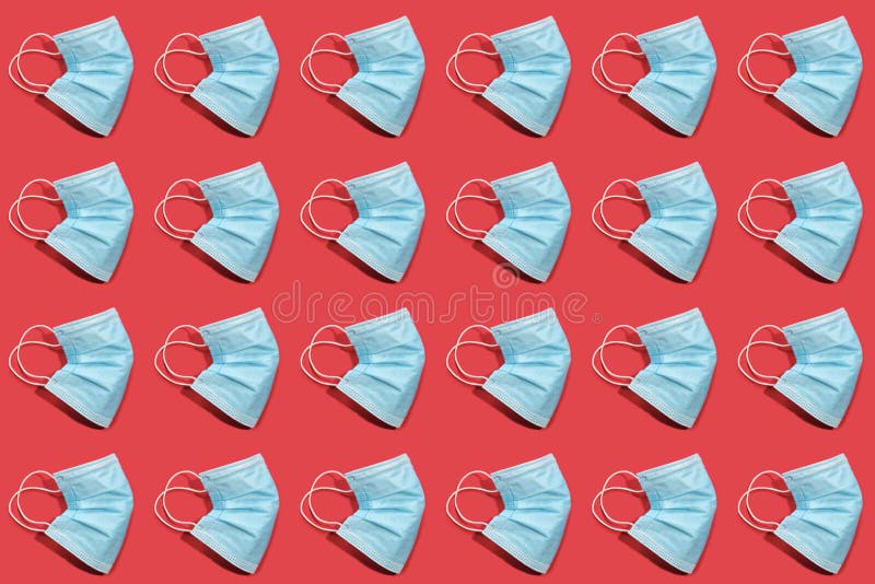 COVID-19 Pattern of Surgical Face Masks on Red Background Stock Image ...