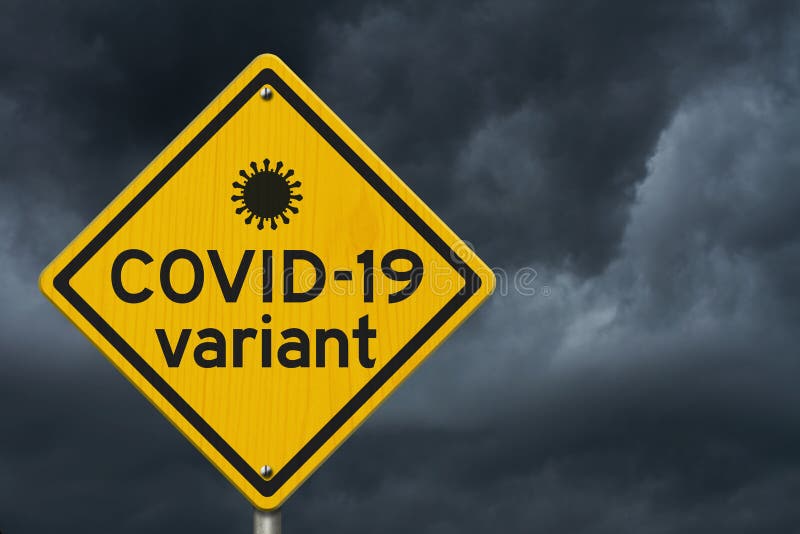 COVID-19 variant warning on a on yellow highway caution road sign