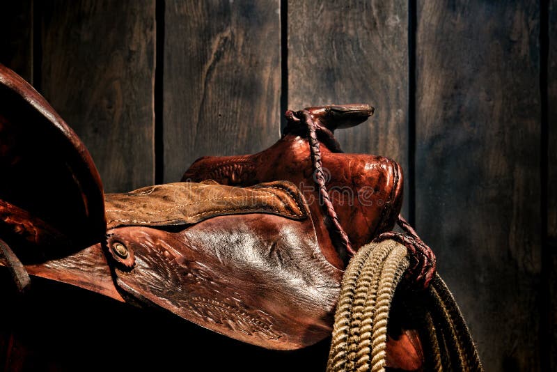 Cowboy ad ovest americano Western Saddle del rodeo di leggenda immagine stock libera da diritti Cowboy ad ovest americano Western Saddle del rodeo di leggenda immagine stock libera da diritti