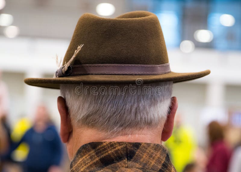 Cowboy couture. Portrait of older man wearing cowboy hat from behind royalty free stock image Cowboy couture. Portrait of older man wearing cowboy hat from behind royalty free stock image