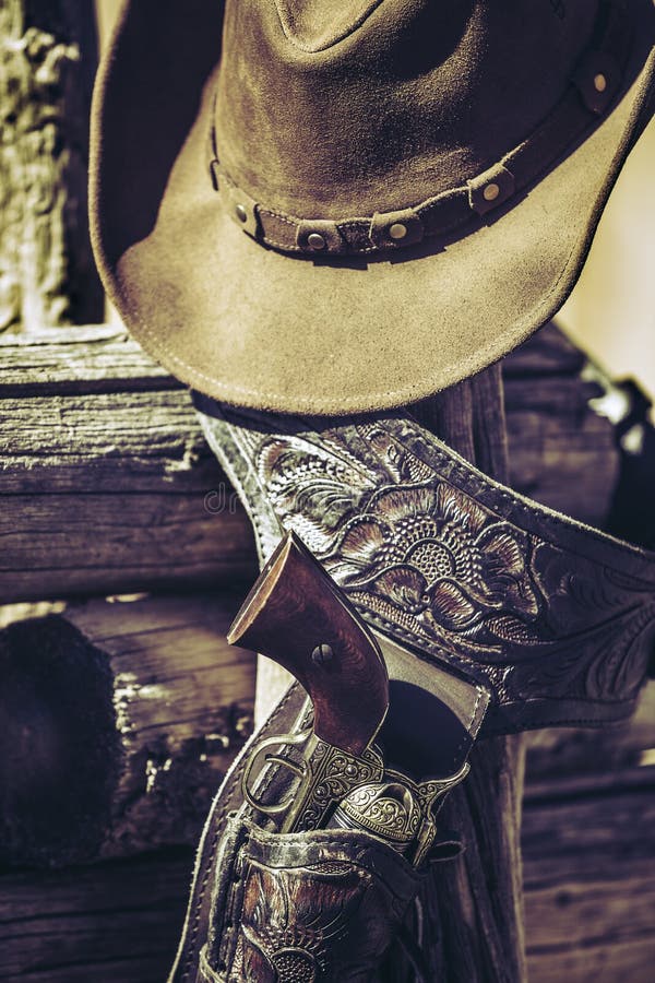 Cowboy gun and hat outdoor stock photo. Image of style - 43622690