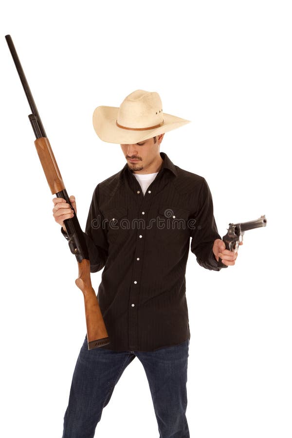 Cowboy holding two guns stock photo. Image of portrait 19176976