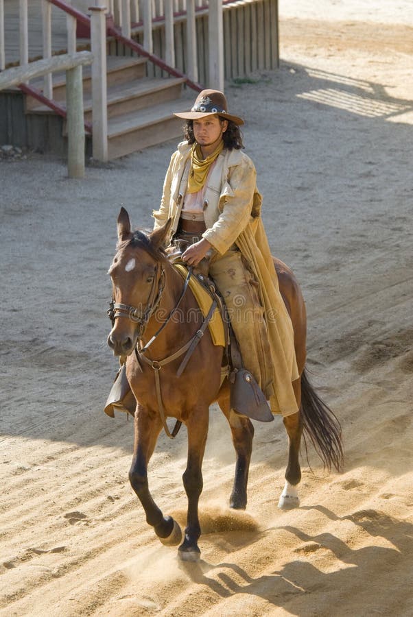 Cowboy riding into town royalty free stock photography Cowboy riding into town royalty free stock photography