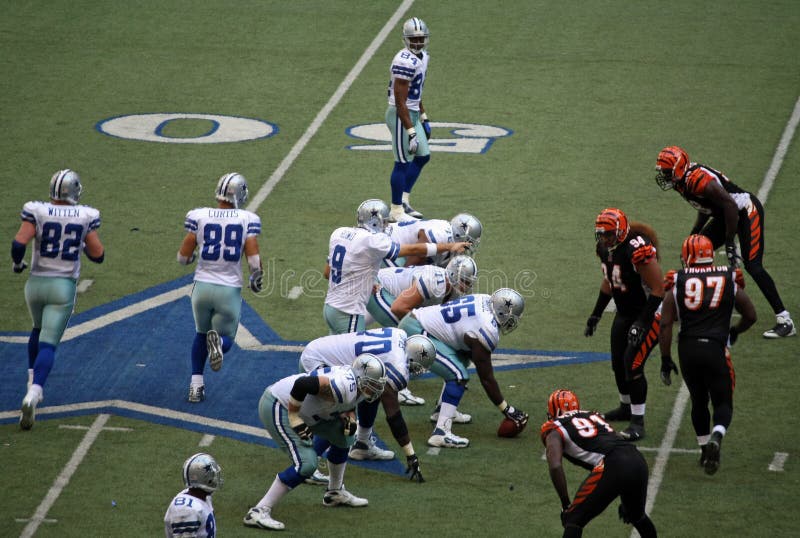 DALLAS - OCT 5: Taken in Texas Staduim, Irving, Texas on October 5, 2008. Dallas quarterback Tony Romo points at the Cininnati Bengals defensive line. The last year Dallas will play in Texas Stadium. DALLAS - OCT 5: Taken in Texas Staduim, Irving, Texas on October 5, 2008. Dallas quarterback Tony Romo points at the Cininnati Bengals defensive line. The last year Dallas will play in Texas Stadium.