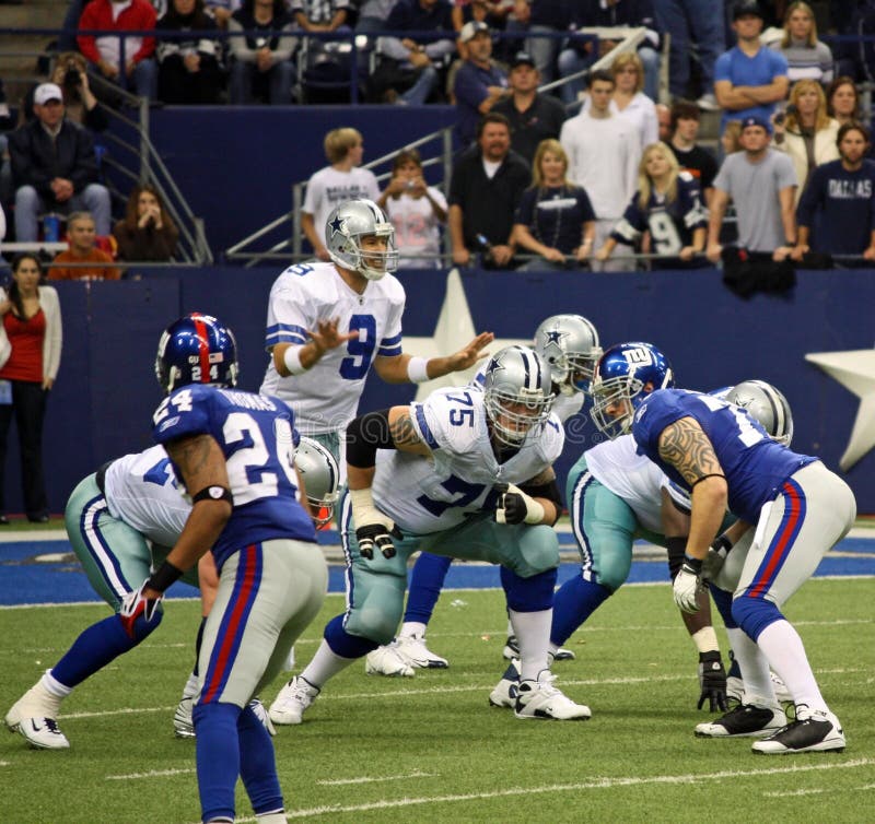 DALLAS - DEC 14: Taken in Texas Stadium on Sunday, December 14, 2008. Dallas Cowboys Quarterback Tony Romo calls signals before the snap from center. DALLAS - DEC 14: Taken in Texas Stadium on Sunday, December 14, 2008. Dallas Cowboys Quarterback Tony Romo calls signals before the snap from center.