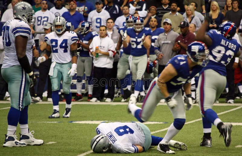 DALLAS - DEC 14: Taken in Texas Stadium on Sunday, December 14, 2008. Dallas Cowboys Quarterback Tony Romo is sacked by the NY Giants defense. DALLAS - DEC 14: Taken in Texas Stadium on Sunday, December 14, 2008. Dallas Cowboys Quarterback Tony Romo is sacked by the NY Giants defense.