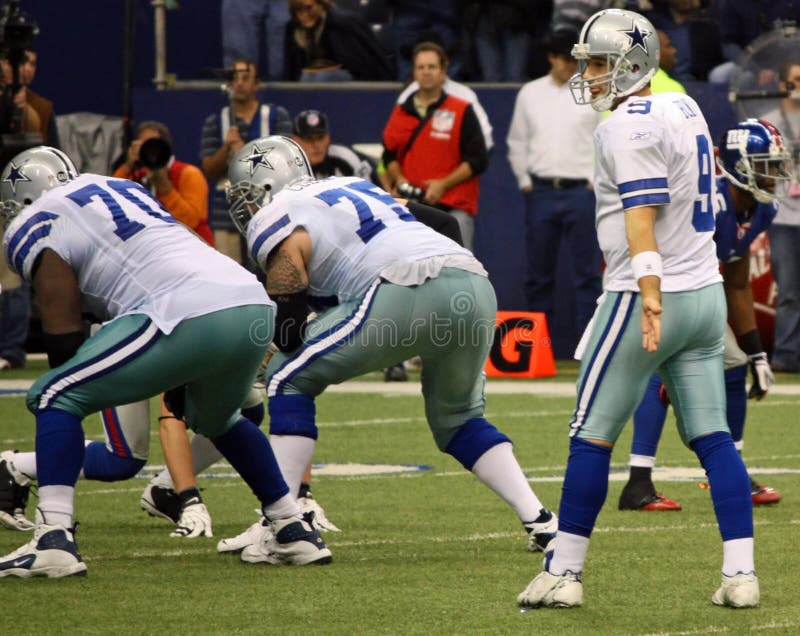 DALLAS - DEC 14: Taken in Texas Stadium on Sunday, December 14, 2008. Dallas Cowboys Quarterback Tony Romo waits for the snap from the center. DALLAS - DEC 14: Taken in Texas Stadium on Sunday, December 14, 2008. Dallas Cowboys Quarterback Tony Romo waits for the snap from the center.