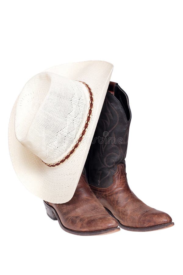 Cowboy boots with hat isolated over white, clipping path. Cowboy boots with hat isolated over white, clipping path