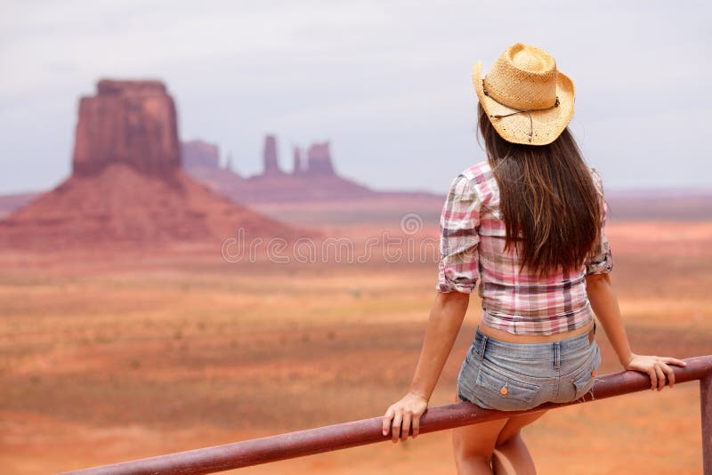 Cowgirl woman enjoying view of Monument Valley