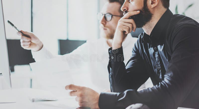 Coworkers Business Meeting Process Sunny Office.Closeup Teamwork Modern Concept.Two Young Bearded Guy Discussing stock photography Coworkers Business Meeting Process Sunny Office.Closeup Teamwork Modern Concept.Two Young Bearded Guy Discussing stock photography