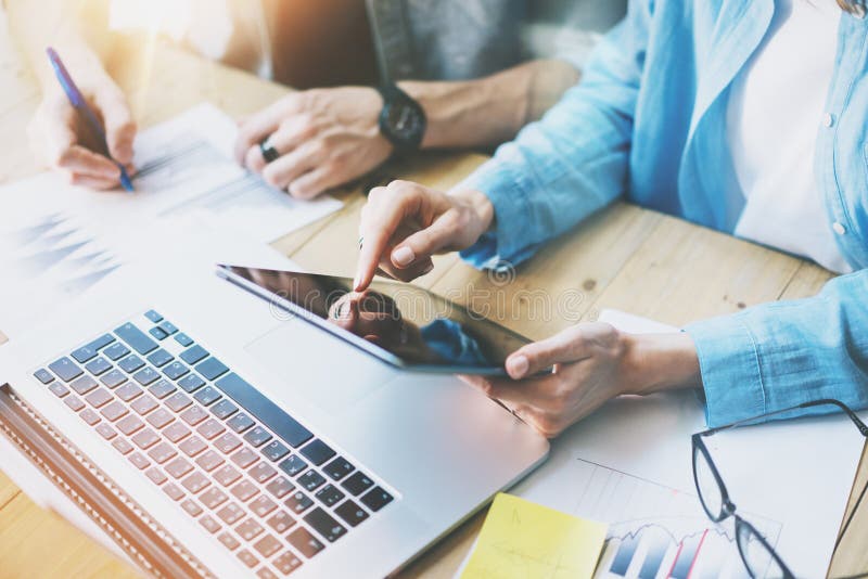 Coworking team work process in modern office.Manager touching screen digital tablet. Young business crew working with stock photos Coworking team work process in modern office.Manager touching screen digital tablet. Young business crew working with stock photos