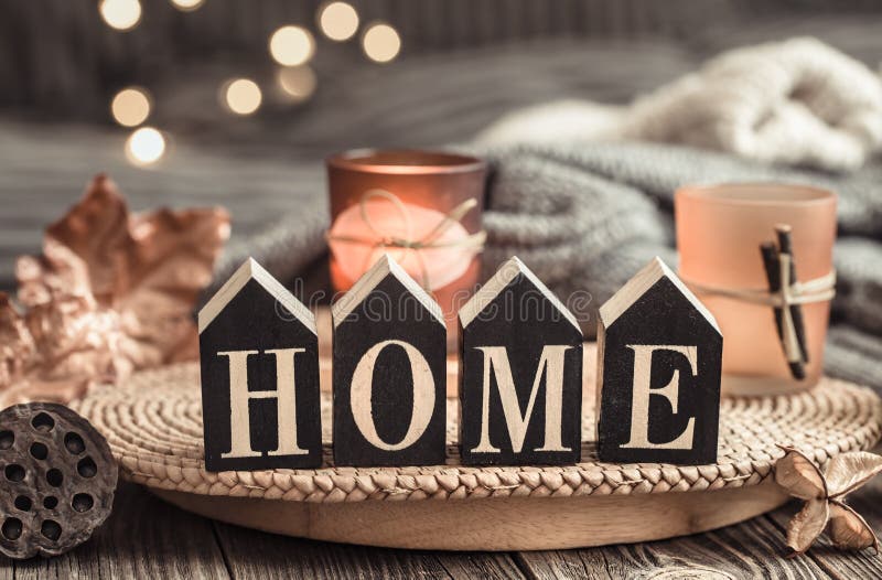 cozy-background-with-wooden-letters-with-the-inscription-home-stock