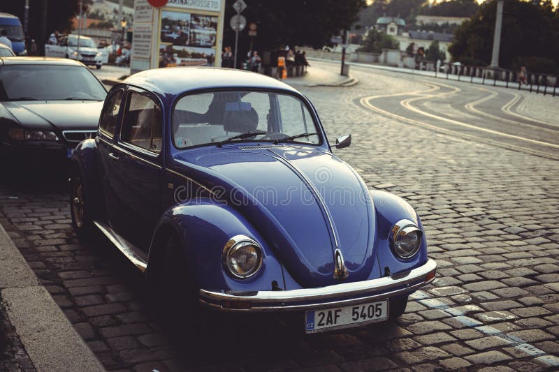 Cozy and beautiful tourist street of old architecture parked cars