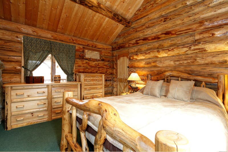 Cozy bedroom in log cabin house royalty free stock image Cozy bedroom in log cabin house royalty free stock image