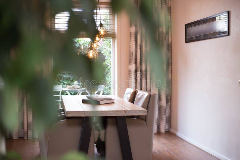 Cozy dining room with modern industrial lamps