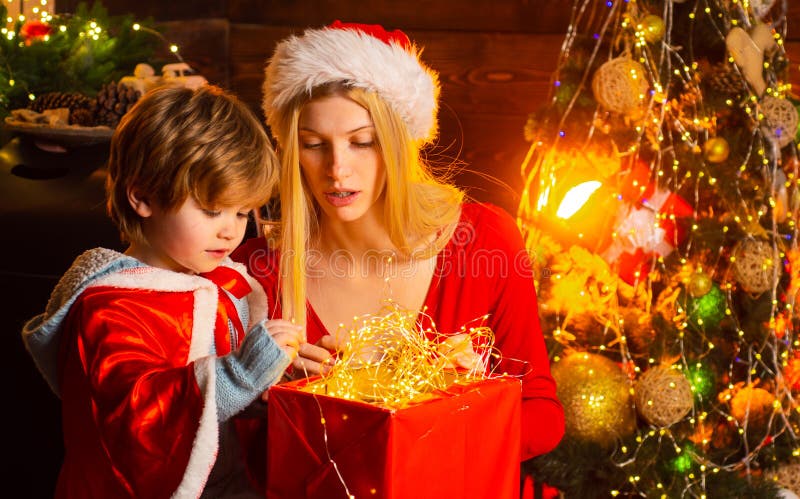 Cozy evening at home. Mom and kid play together christmas eve. Happy family. Mother and little child boy son friendly royalty free stock images Cozy evening at home. Mom and kid play together christmas eve. Happy family. Mother and little child boy son friendly royalty free stock images