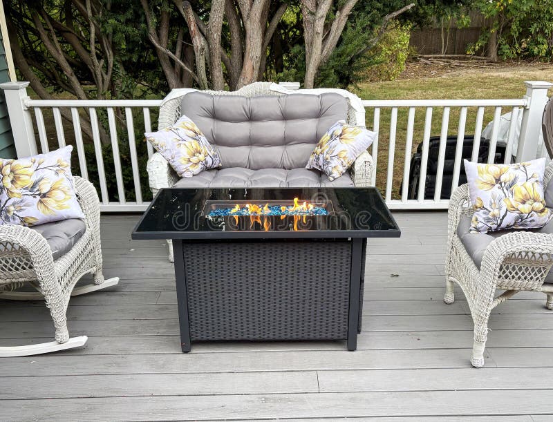 Cozy Fire Pit Setup on a Composite Deck With Modern Seating stock photo