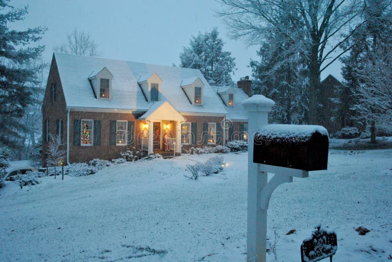 Cozy house in the snow on a winter evening in December