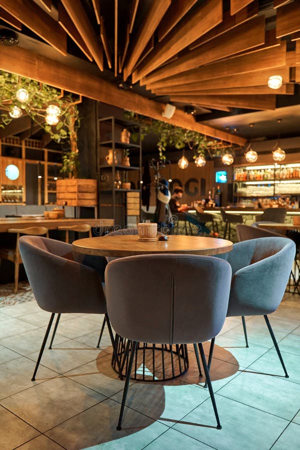 Cozy Interior of the Restaurant with Warm Light and Soft Armchairs