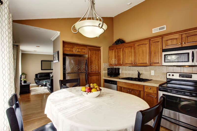 Cozy Kitchen And Dining Room Interior With Black Table Set And