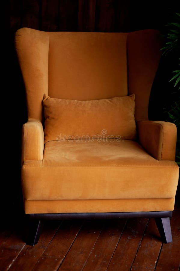 Cozy Old Mustardcolored Armchair.Interior in Retro Style. Stock Photo