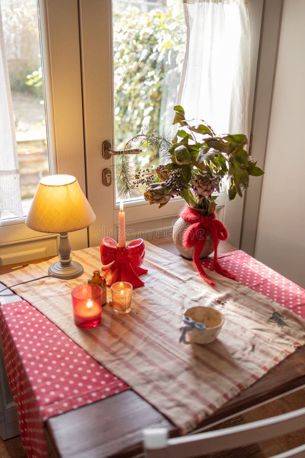 Cozy Rustic Table with Candles and Greenery royalty free stock images