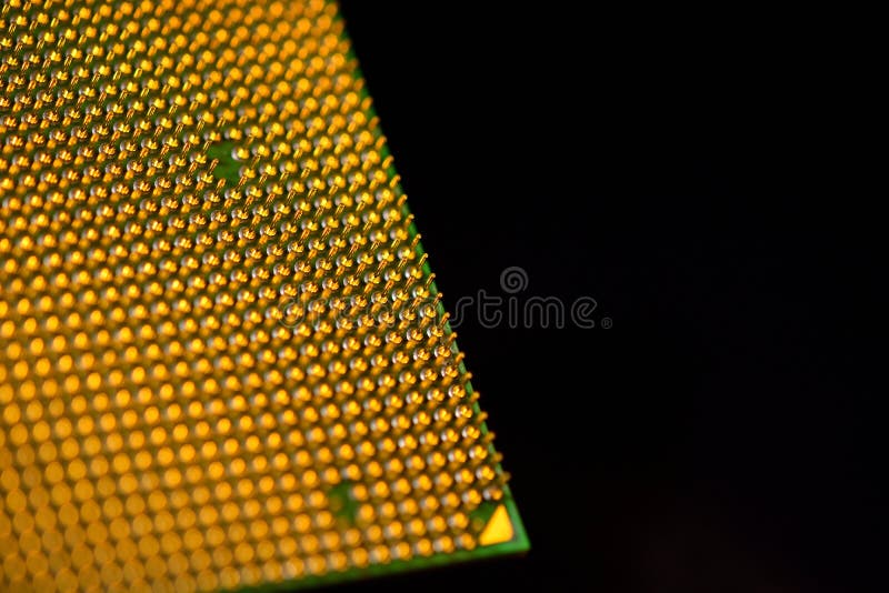 CPU - central processor unit upside-down on a black background. Pins. Copy space royalty free stock photography