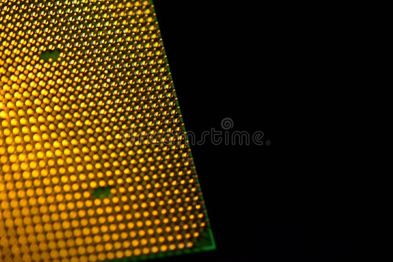 CPU pins. Central processor unit upside-down on a black background. Copy space royalty free stock photo