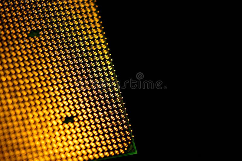 CPU pins. Central processor unit upside-down on a black background. Copy space stock image