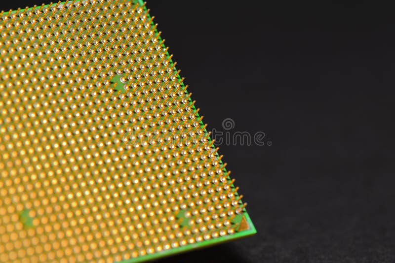 CPU pins. Central processor unit upside-down on a black background. Copy space stock image