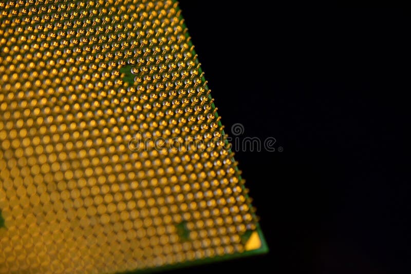 CPU pins. Central processor unit upside-down on a black background. Copy space royalty free stock image