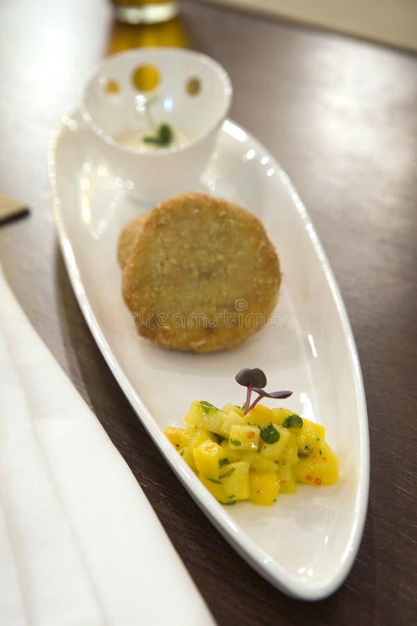 Crab stuffed patties with mango compote stock images Crab stuffed patties with mango compote stock images