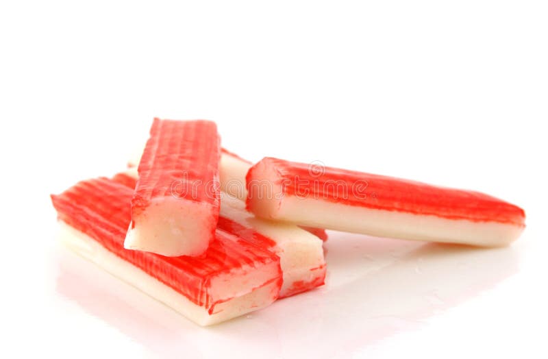 5 Crab sticks on a reflective white background. 5 Crab sticks on a reflective white background