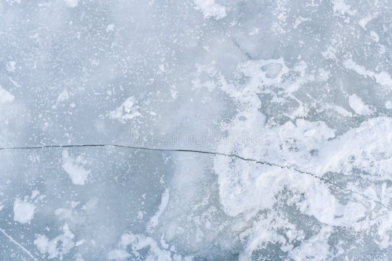 Crack on ice surface of river.