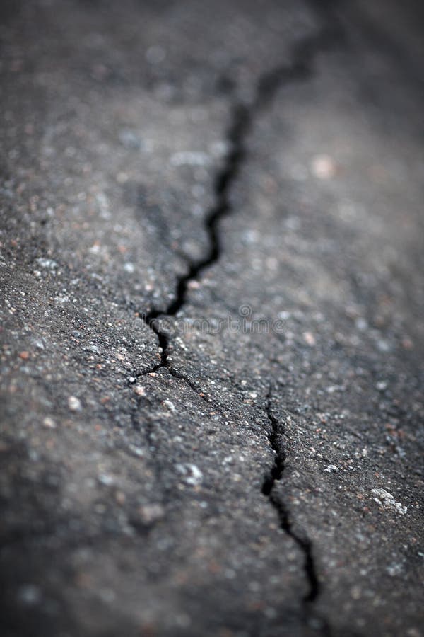 Closeup of cracks in asphalt surface by earthquake,shallow focus. Closeup of cracks in asphalt surface by earthquake,shallow focus